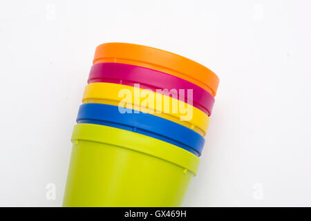 plastic multi-colored glasses isolated on white background. Glass of various color. Stock Photo