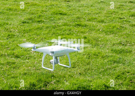 DJI Phantom 4 UAV Drone in flight Stock Photo