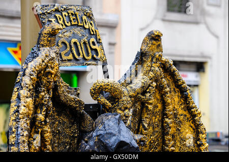 Spain, Barcelona. La Rambla is a street in central Barcelona. Street performance artist. Stock Photo