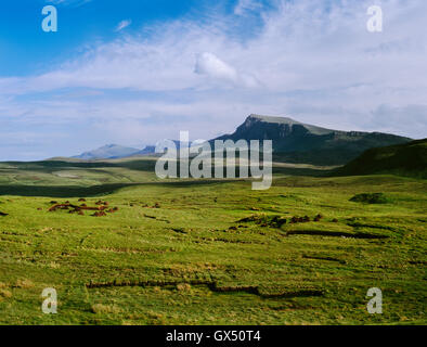 Isle of Skye: looking S from Staffin to Uig (Quiraing) road at moorland, peat cuttings, turf stacks & part of the Trotternish Ridge. Stock Photo