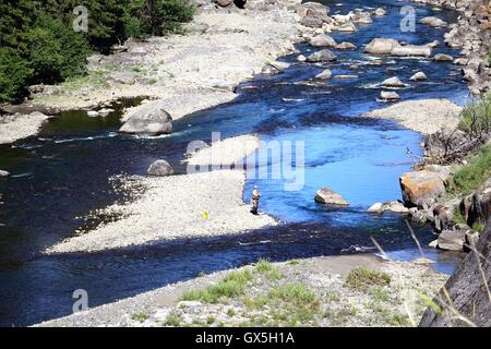 Fly Fishing, Yellowstone National Park. A woman fly fishing in the