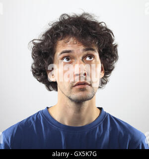 Cool, young man looking up portrait. Stock Photo