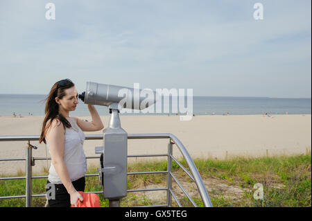 Close-Up of Sightseeing Binoculars with Beach Background Stock Photo