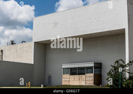 An outline of a logo sign outside of a closed Macy's retail store in Columbus, Ohio on July 23, 2016. Stock Photo