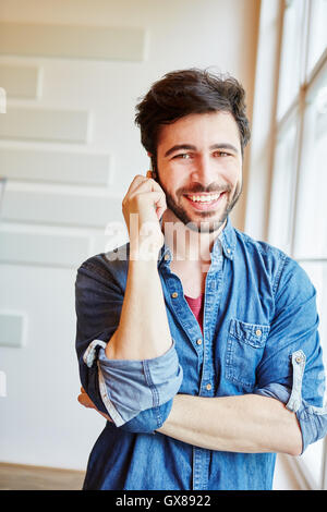 Successful young businessman calling on the phone with cell phone Stock Photo