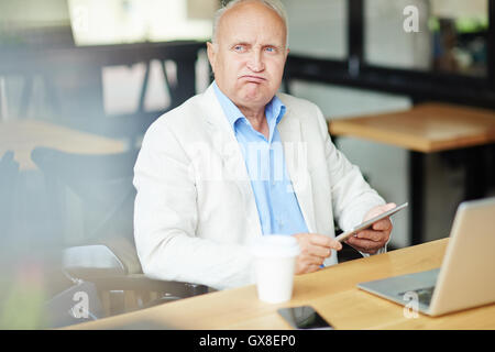 Senior businessman in cafe Stock Photo
