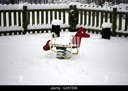 Playground Rocking Horse in the snow Stock Photo