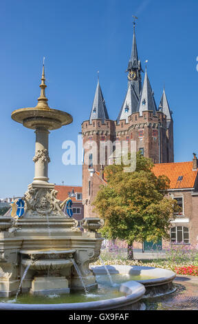 Old city gate Sassenpoort and foutain in Zwolle, Netherlands Stock Photo