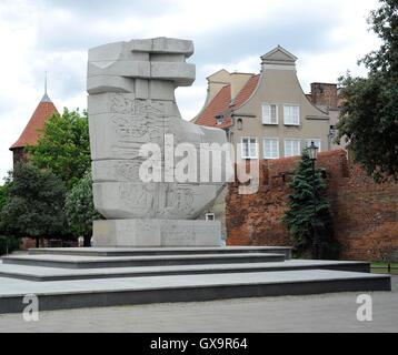 Poland. Gdansk. Monument to Those Who Fell in a fight for the Polish Character in the period from the Gdansk massacre, 1308, until the end of II World War. Erected in 1969 by Wawrzyniec Samp (b. 1939) and Wiesław Pietron (b. 1934) and symbolises an axe stuck in the ground. Square at Podwale Staromiejskie Street. Stock Photo