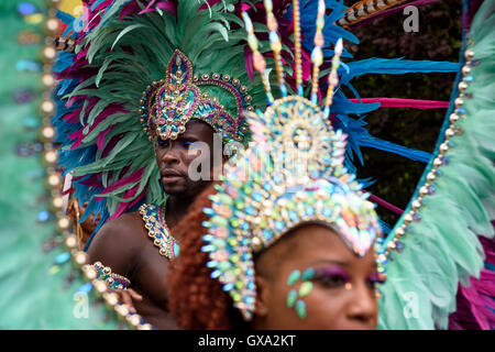 Mythodyssey dancers wearing light green feather headdresses during the 50th Notting Hill Carnival celebrations Stock Photo