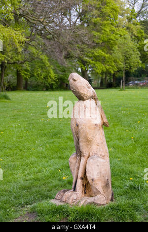 Sheffield, UK 03 May 2014: Carved wooden rabbit on 03 May in Meersbrook Park, Sheffield, Yorkshire, UK Stock Photo