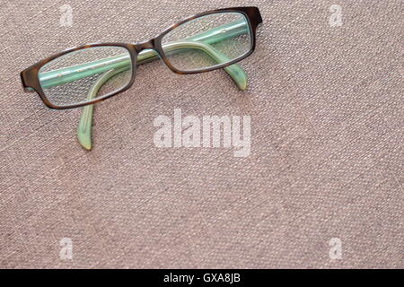 Designer eye glasses on a gray background Stock Photo