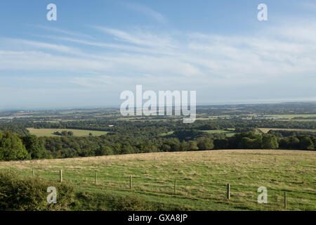 View from the South downs near Chichester looking across the coastal plain towards the English Channel. Stock Photo