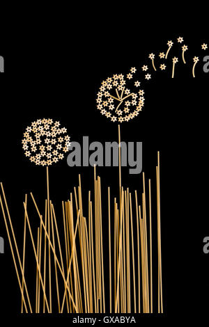 macaroni products in the form of dandelions growing in the right on a dark background Stock Photo