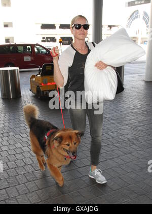 Chelsea Handler seen with her dog and carrying a white pillow as she departs from Los Angeles International Airport (LAX)  Featuring: Chelsea Handler Where: Los Angeles, California, United States When: 30 Jun 2016 Stock Photo