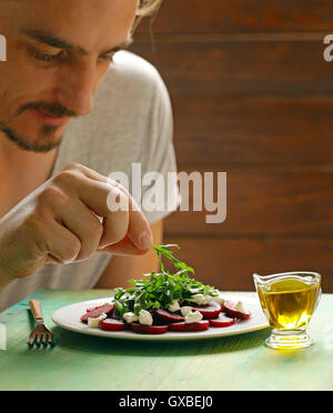 salad of boiled beets, cheese and arugula Stock Photo