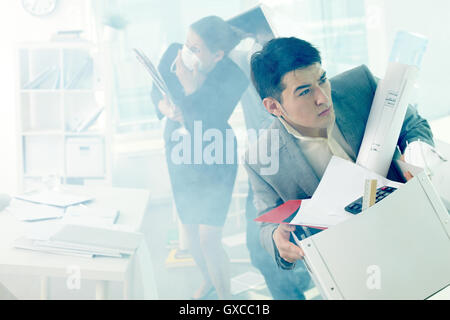 People in smoky office Stock Photo