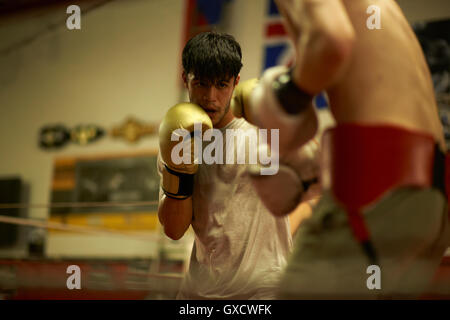 Two boxers sparring in boxing ring Stock Photo