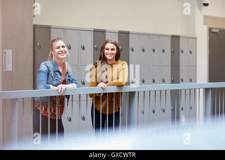 Portrait of two female students in higher education college locker room Stock Photo