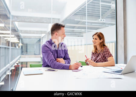 Male and female designers meeting in design studio Stock Photo