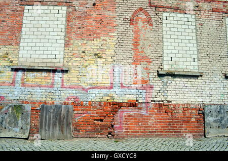 Old brick wall with bricked up window Stock Photo