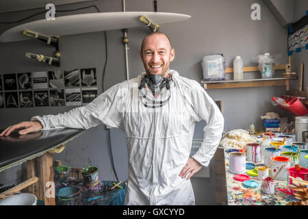 Portrait of male carpenter in surfboard maker's workshop Stock Photo