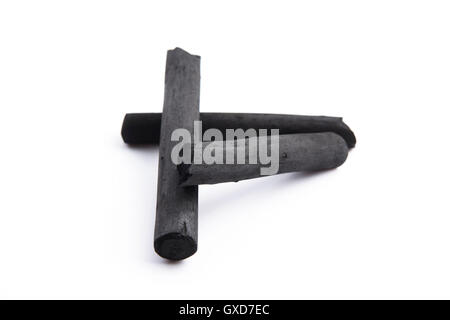 Artist's black charcoal isolated on white Stock Photo