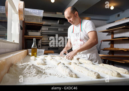 Baker working in bakery Stock Photo