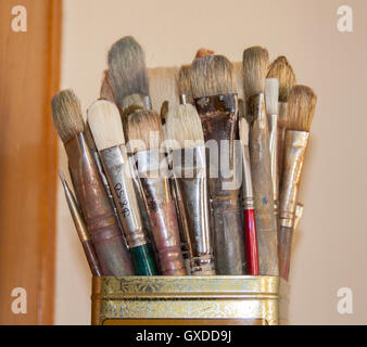 Paintbrushes in tin metal can Stock Photo