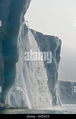 Water Pours From face of Brasvellbreen Glacier on Nordaustlandet. Svalbard Archipelago, Arctic Norway. Stock Photo