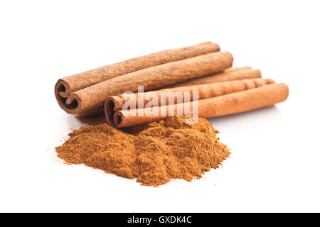 Cinnamon sticks and ground cinnamon isolated on white background. Stock Photo