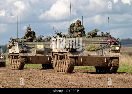 Convoy of British Army FV432 Armoured Personnel Carriers and a military landrover on Salisbury Plain Training Area,Wiltshire,UK. Stock Photo