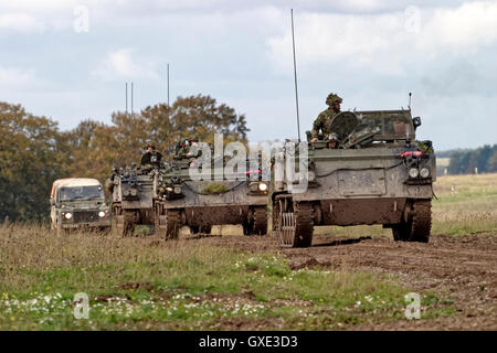 Convoy of British Army FV432 Armoured Personnel Carriers and a military landrover on Salisbury Plain Training Area,Wiltshire,UK. Stock Photo