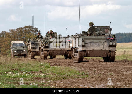 A convoy of British Army FV432 Armoured Personnel Carriers and a military landrover on Salisbury Plain Training Area,Wiltshire,UK. Stock Photo