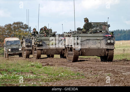 Convoy of British Army FV432 Armoured Personnel Carriers and a military landrover on Salisbury Plain Training Area,Wiltshire,UK. Stock Photo