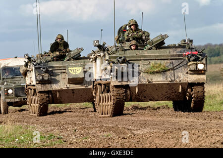 Convoy of British Army FV432 Armoured Personnel Carriers and a military landrover on Salisbury Plain Training Area,Wiltshire,UK. Stock Photo