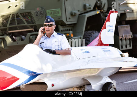 An Air Force officer sits in a miniature fighter jet during the Cheyenne Frontier Days parade through the state capital July 23, 2015 in Cheyenne, Wyoming. Frontier Days celebrates the cowboy traditions of the west with a rodeo, parade and fair. Stock Photo