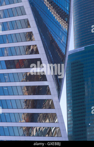 Cotemporary architecture concept background: abstract modern business building facades which represent walls of glass windows re Stock Photo