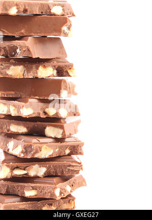 Tasty morsel of milk chocolate with nuts. Stock Photo