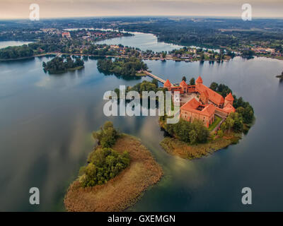 Trakai, Lithuania: aerial UAV top view of Island Castle in the sunrise. Historical residence in capital city of Grand Duchy of L
