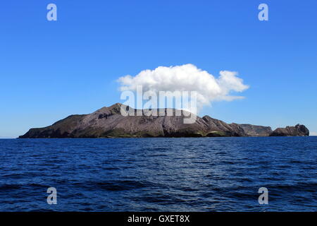 The active volcano White Island with its smoking sulphuric gasses gathered above it Stock Photo