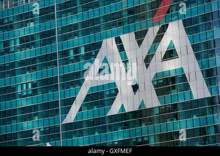 A logo sign outside of a facility occupied by AXA in Milan, Italy on September 3, 2016. Stock Photo
