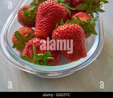 Fresh strawberries on old wooden background Stock Photo