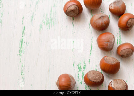 Nuts in the shell on a wooden Board closeup Stock Photo