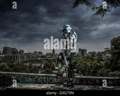 Robot patrolling city holding rifle Stock Photo