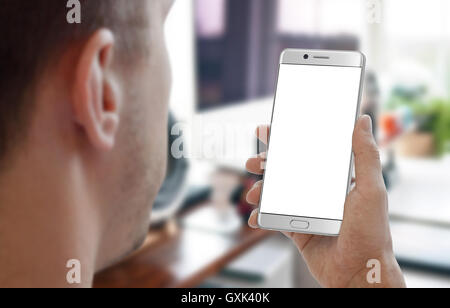 Man work on smartphone in room office interior. Isolated white display for mockup. Stock Photo