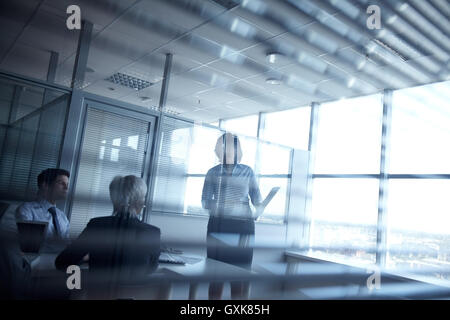 Meeting in dark room Stock Photo