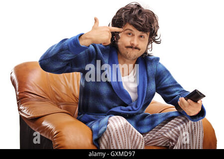 Frustrated man holding his hand against his head and making a gun gesture isolated on white background Stock Photo