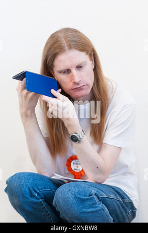 London, UK. 17th September, 2016.   Ginger, auburn and redheaded people gathered in Angel, north London, to celebrate 'Redhead Day', an annual event for redheads and lovers of red hair.  Sharing all things red, they enjoyed live music, bought red related products and food and drink.  Credit:  Stephen Chung / Alamy Live News Stock Photo