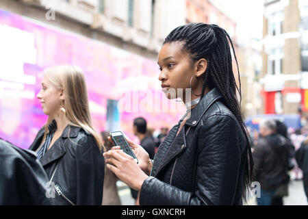 London, UK - 17th September 2016. Second day of London Fashion Week SS17. Street fashion photography at Brewer Street, venue of several fashion shows and street modeling with original accessories, shoes and different outfits. Credit: Alberto Pezzali/Alamy Live News Stock Photo